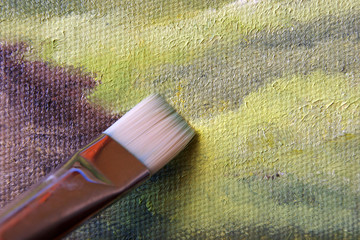 Paintbrush againg the canvas