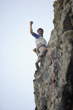 Argentinean man rock climbing