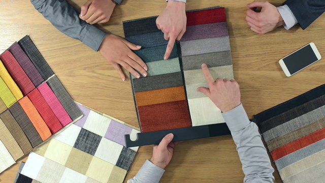 Decorator showing fabric swatches