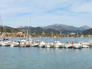 Fototapeta na wymiar White Yachts And Boats In In The Port D’Andratx, Majorca Island