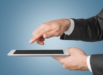 Analyzing. Touch screen ,touch- tablet in hands