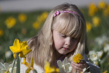 Little girl in spring sunny park