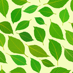 Green leafs on light yellow background seamless pattern