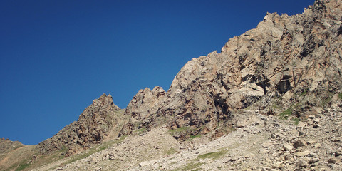 Mountain pass at the blue sky on a sunny day - vintage photo.