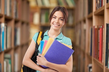 Teen. Beautiful student girl with backpack and books, isolated