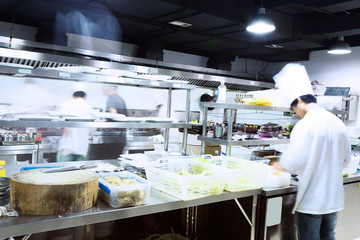 modern kitchen and busy chefs