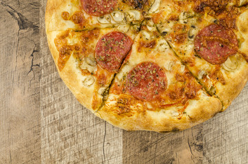 Italian pizza on wooden table