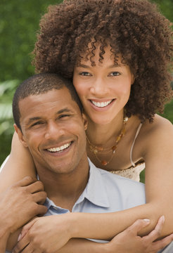 African couple hugging