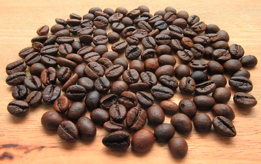 Roasted brown coffee beans,on wood background