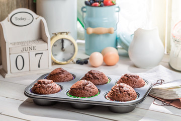 Decorating tasty muffins with caster sugar
