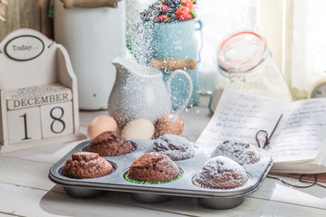 Decorating tasty cupcakes with caster sugar