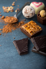 selection of artisan chocolates praline on black background