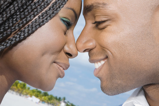 African couple smiling at each other