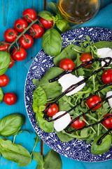 Healthy diet salad with tomatoes, mozzarella,basil and balsamic