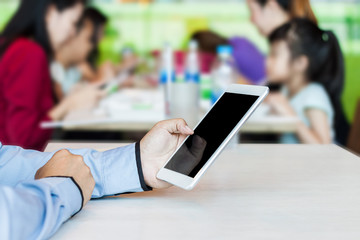 Businessman working by using digital tablet