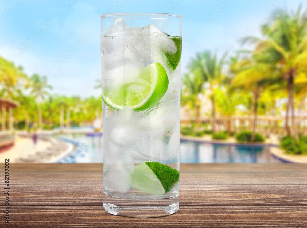 Poster Vodka. Cocktail with ice and lime slice isolated on white