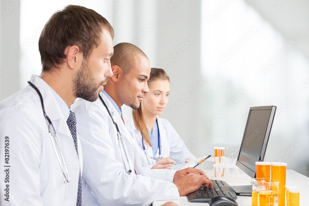 Poster laboratory. scientists working on computer in the laboratory.