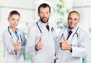 Fototapeta premium Doctor. Portrait of happy doctors standing in a row