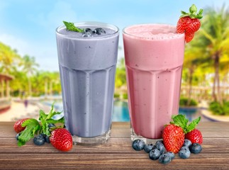 Fruit. Fresh Blueberry and Strawberry Smoothie on a background