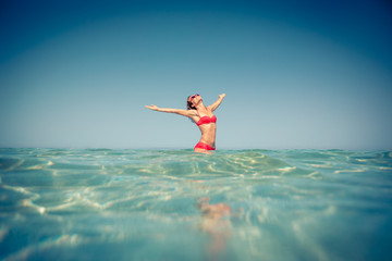 Fototapeta na wymiar Young woman in the sea