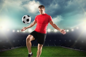 Soccer. One african man soccer player green jersey juggling in