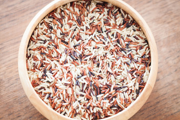 Organic Dry Multi Grain Rice in wooden bowl