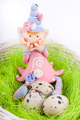 Ashamed fairy on the nest with quail eggs