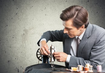 Tailor. Tailors at work. Two confident tailors working on
