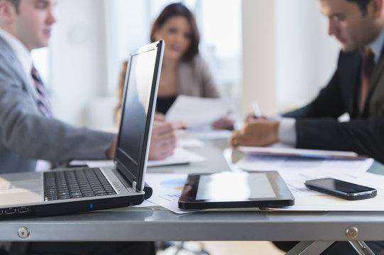 Close up of laptop, tablet computer and cell phone in office