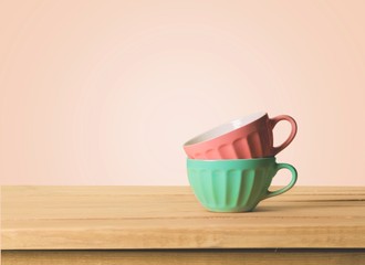 Retro. Colorful bowls on wooden table over grunge background