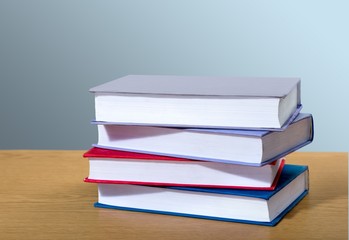 Book. A pile of books with library on the back