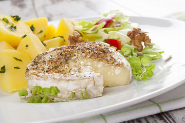 Baked melted camembert cheese.