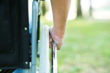 Detail of a man using a wheelchair