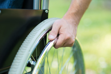 Detail of a man using a wheelchair
