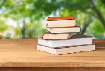 Retro. Vintage old books on wooden deck table over grunge