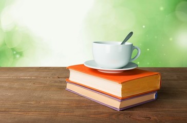 Tea. Cup of coffee and book on wooden table