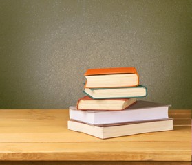 Retro. Vintage old books on wooden deck table over grunge