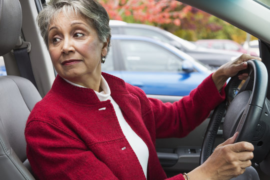 Mixed race woman driving in car