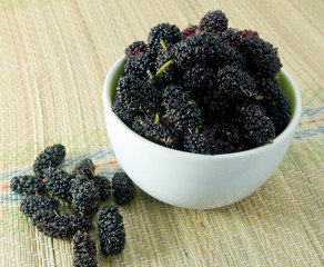Fresh Mulberry in A Bowl on Straw Mat