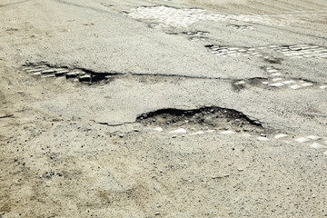 Very bad quality road with potholes