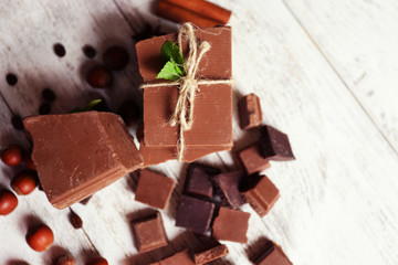 Set of chocolate on wooden table, top view