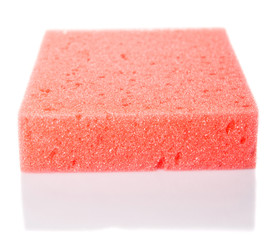 Red dish washing sponge over white background