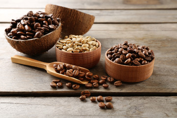 Various of coffee in small dishes on wooden background