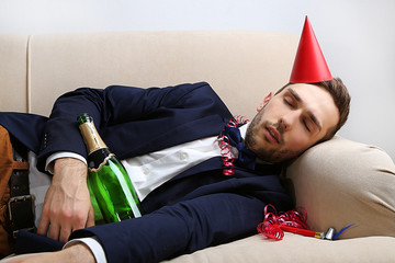 Young man on couch after fun close up