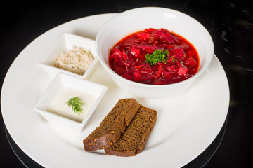 Borsch with creme fraiche, lard and bread
