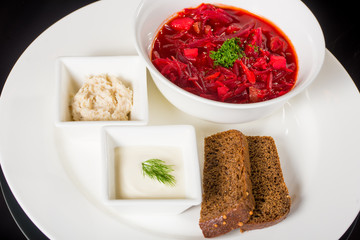 Borsch with creme fraiche, lard and bread
