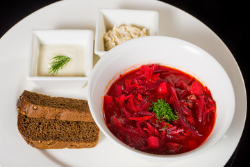 Borsch with creme fraiche, lard and bread
