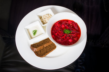Borsch with creme fraiche, lard and bread
