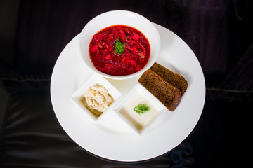 Borsch with creme fraiche, lard and bread
