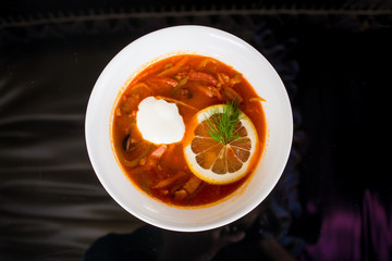 Red soup with with lemon and sour cream